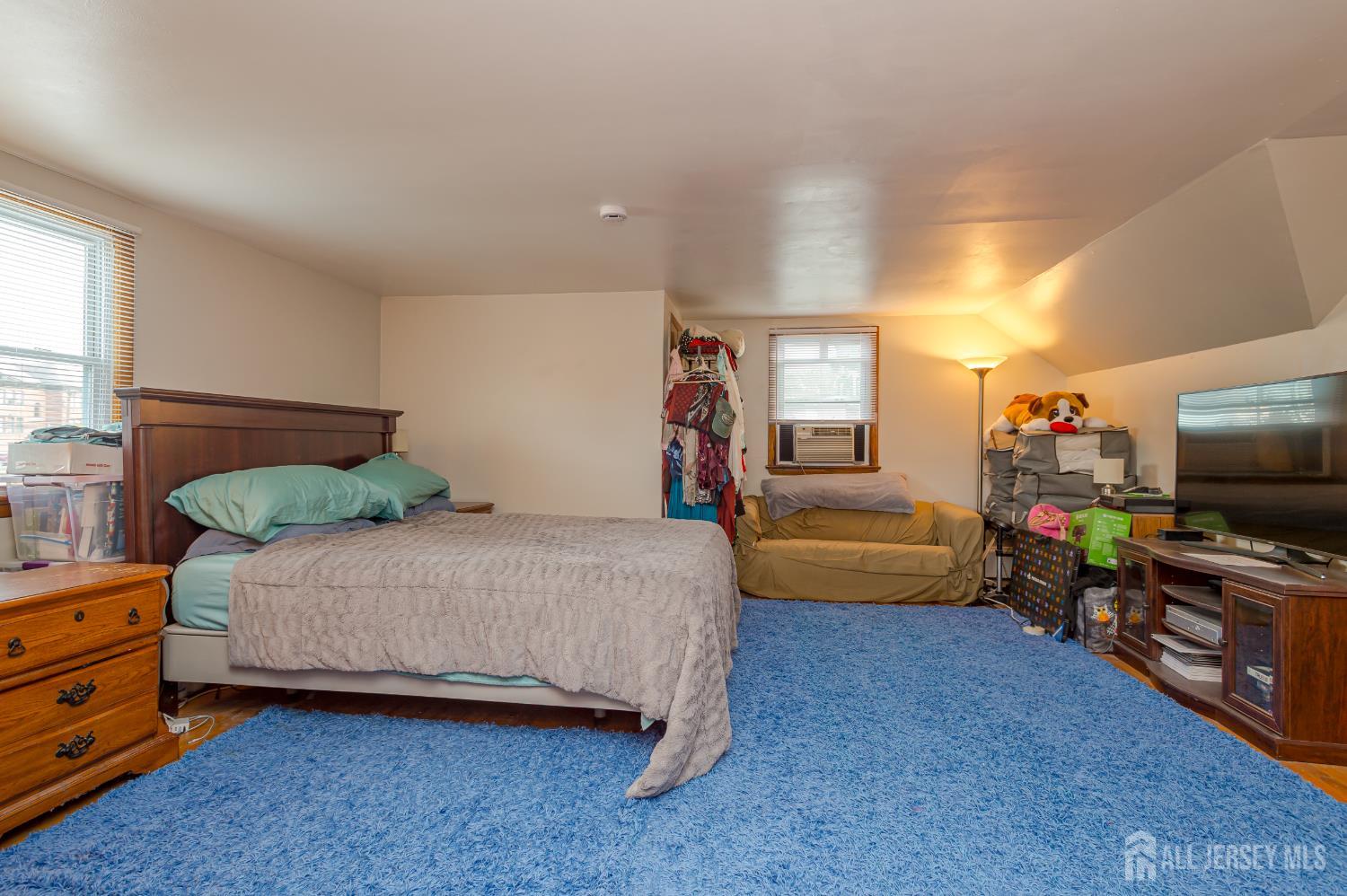 10 Mary Avenue Fords, NJ 08863 - Photo 18 of 23 a bedroom with a bed and a tv