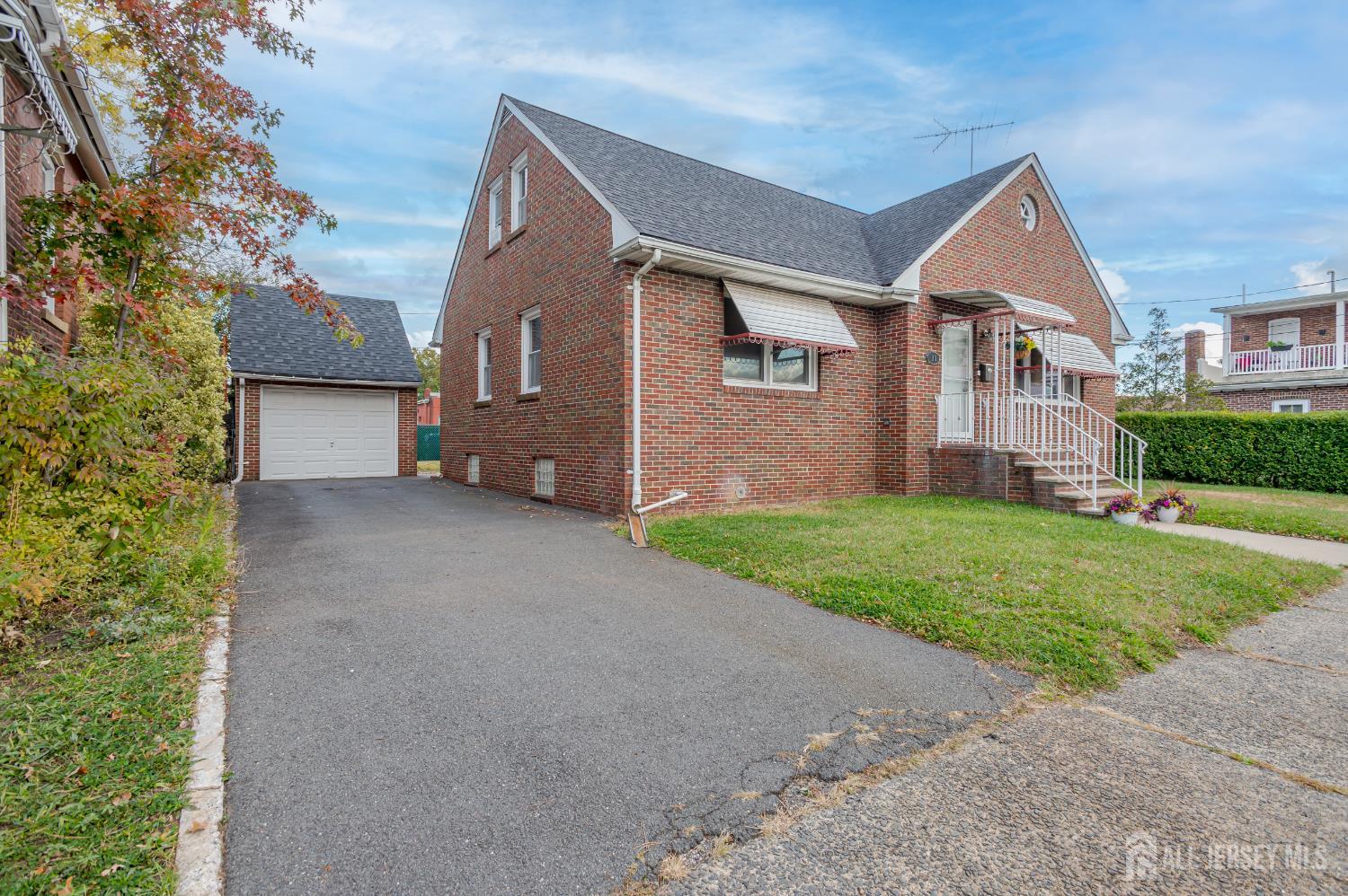 10 Mary Avenue Fords, NJ 08863 - Photo 2 of 23 a view of a house with a yard and garage