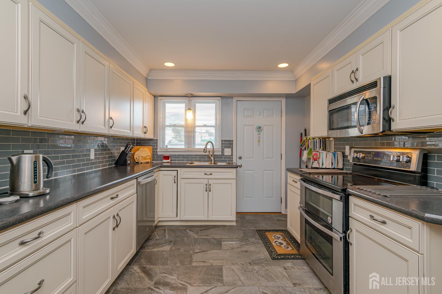 10 Mary Avenue Fords, NJ 08863 - Photo 9 of 23 a kitchen with granite countertop cabinets stainless steel appliances and a counter space