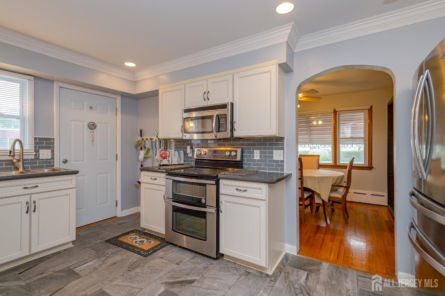 10 Mary Avenue Fords, NJ 08863 - Photo 10 of 23 a kitchen with stainless steel appliances granite countertop a stove and a sink