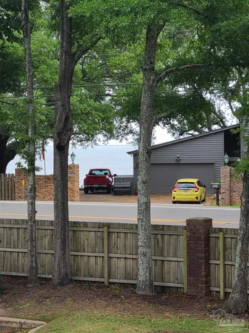 a view of a backyard with sitting area