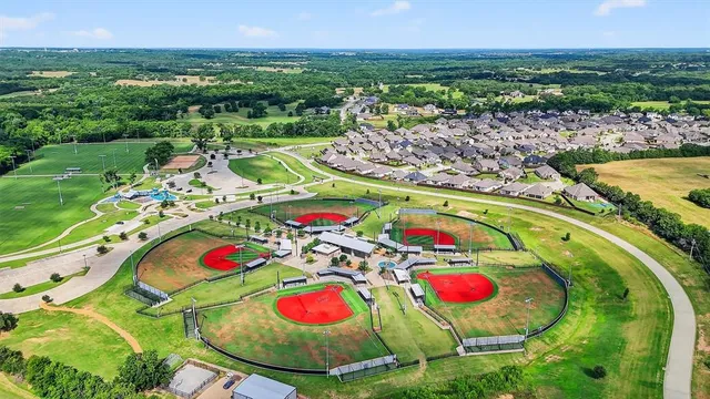 a view of swimming pool a fire pit and outdoor seating