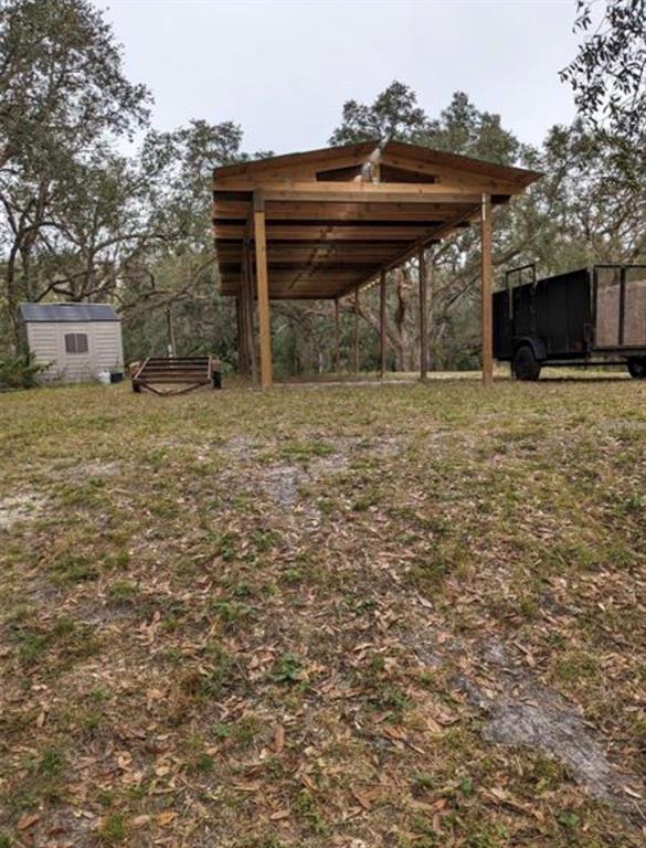 36564 Singletary Road Myakka City, FL 34251 - Photo 11 of 19 a front view of a house with a garden