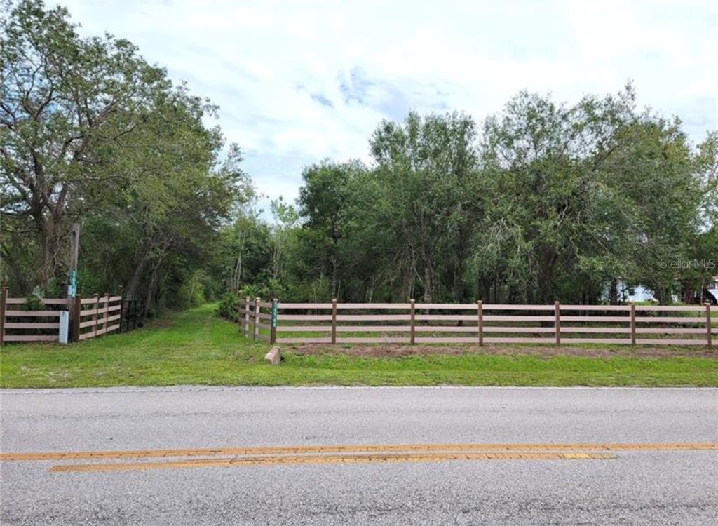36564 Singletary Road Myakka City, FL 34251 - Photo 4 of 19 a view of a bench in a yard