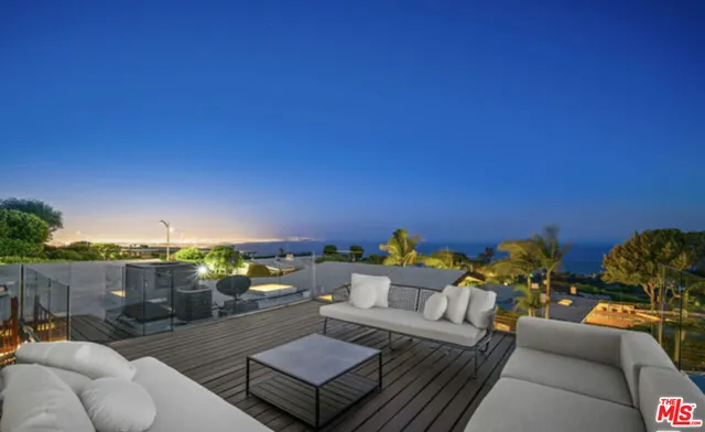 swimming pool view with a seating space
