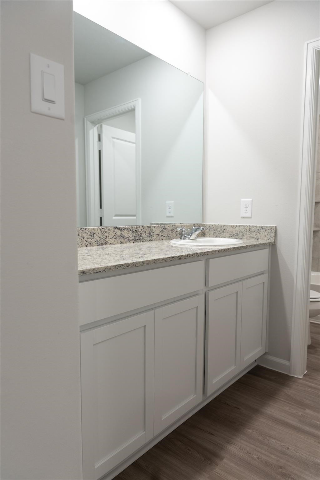 64 Valiant Ridge Trail Magnolia, TX 77354 - Photo 22 of 33 a bathroom with a sink and a mirror