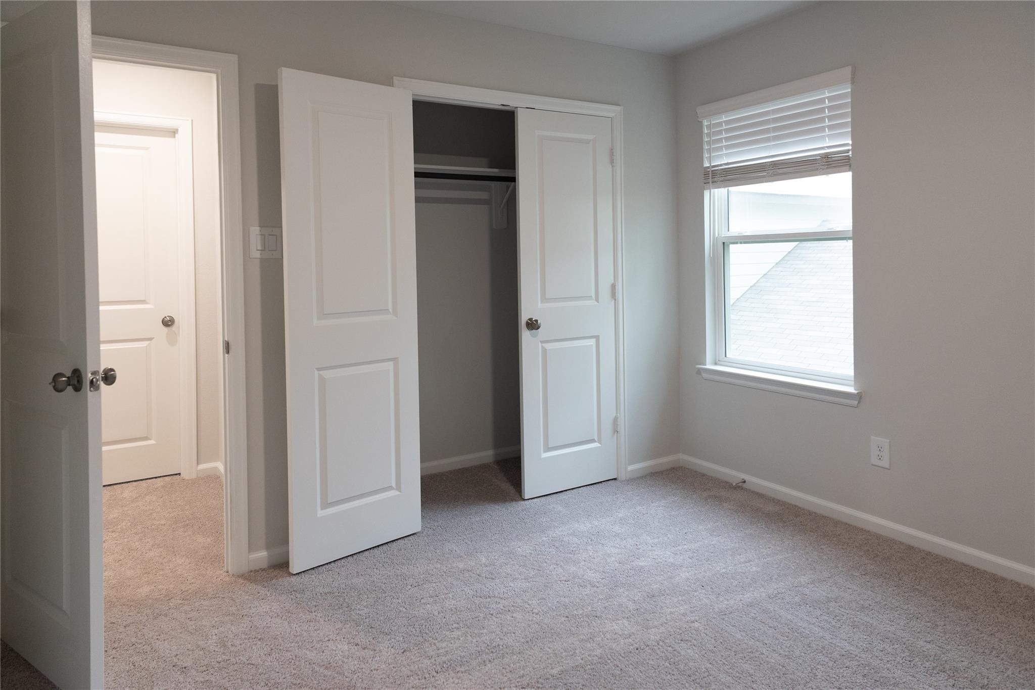 64 Valiant Ridge Trail Magnolia, TX 77354 - Photo 24 of 33 an empty room with windows and closet