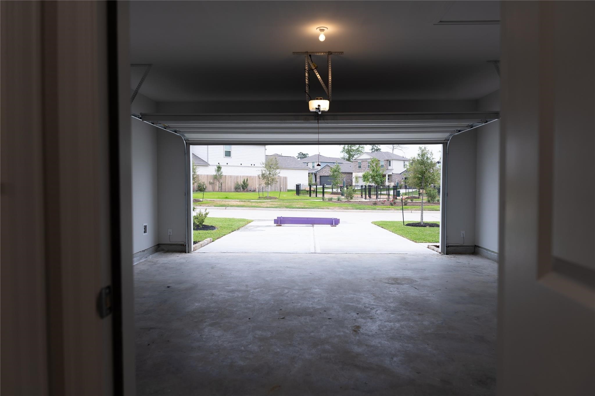 64 Valiant Ridge Trail Magnolia, TX 77354 - Photo 30 of 33 a view of an empty room with a floor to ceiling window and a table
