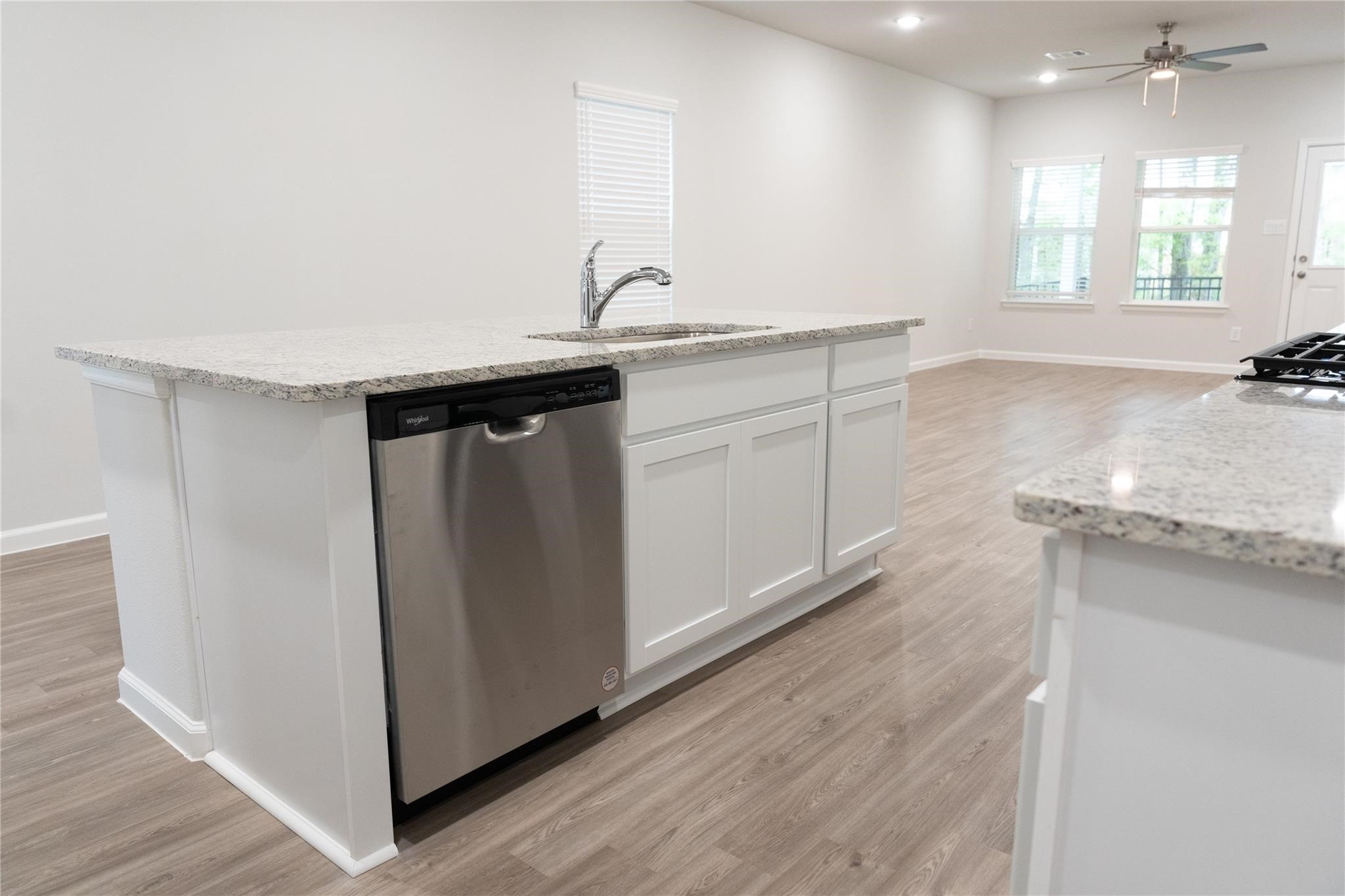 64 Valiant Ridge Trail Magnolia, TX 77354 - Photo 7 of 33 a bathroom with a granite countertop sink a mirror and a vanity