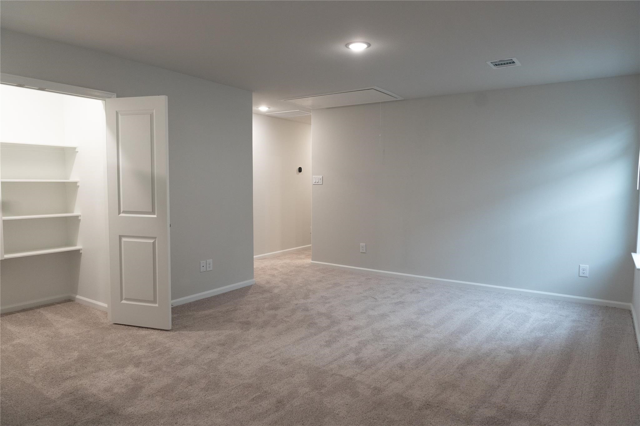 64 Valiant Ridge Trail Magnolia, TX 77354 - Photo 9 of 33 an empty room with closet and windows