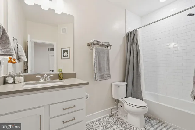 a bed room with a bed and a chandelier