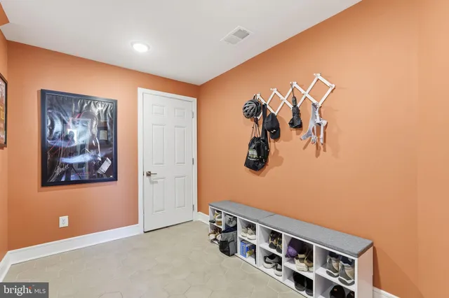 a living room with lots of furniture and baby book shelf