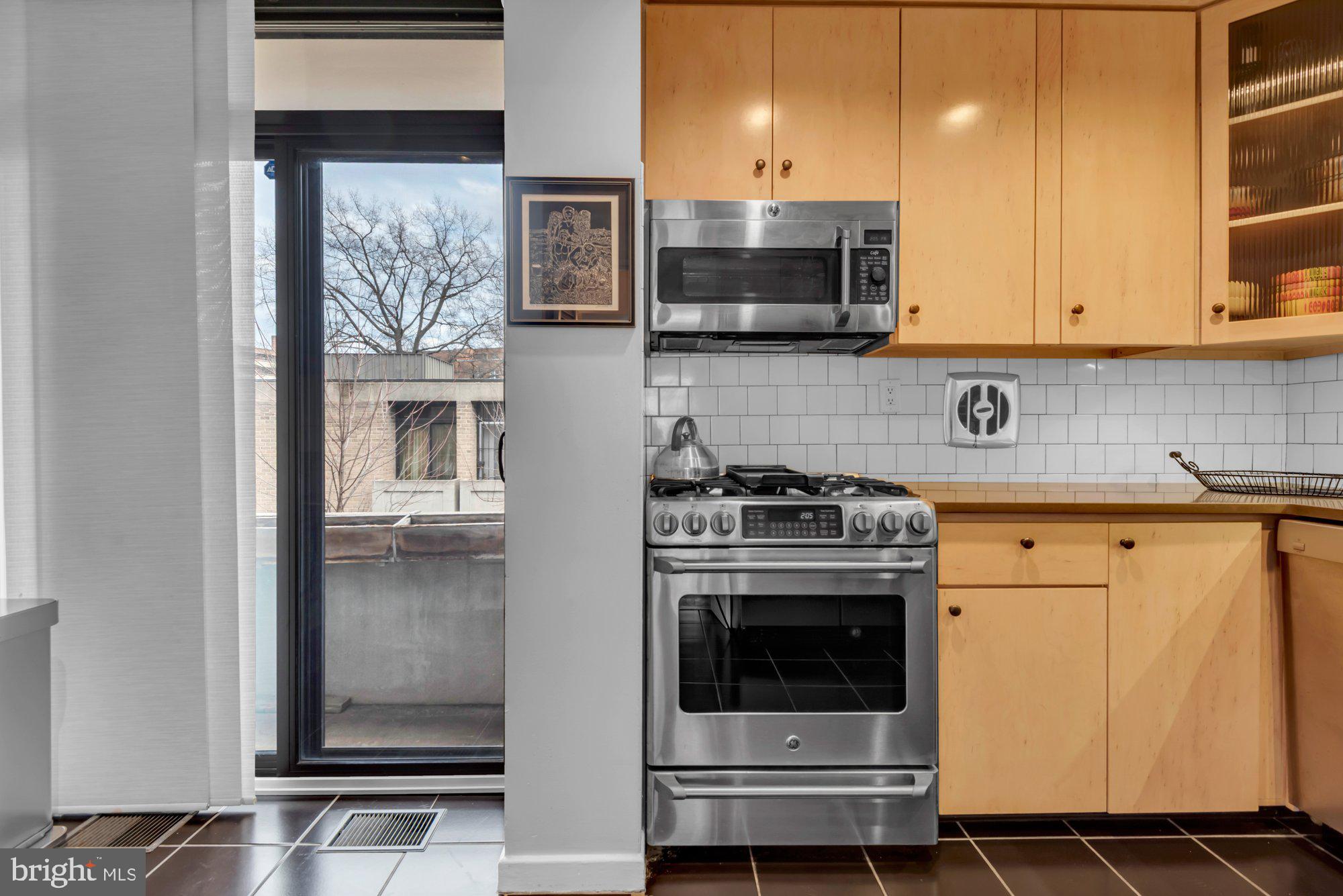 1263 Delaware Avenue Southwest, Unit 53 Washington, DC 20024 - Photo 12 of 65 Beautiful Cabinetry and Sliding Door to Balcony