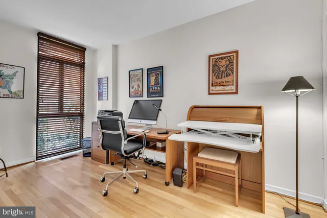 a living room with furniture rug and window