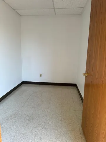 a view of a hallway with two windows