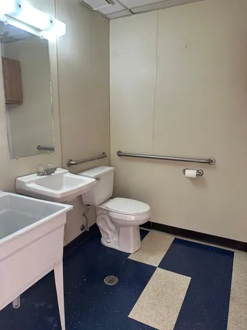 a bathroom with a shower and a mirror