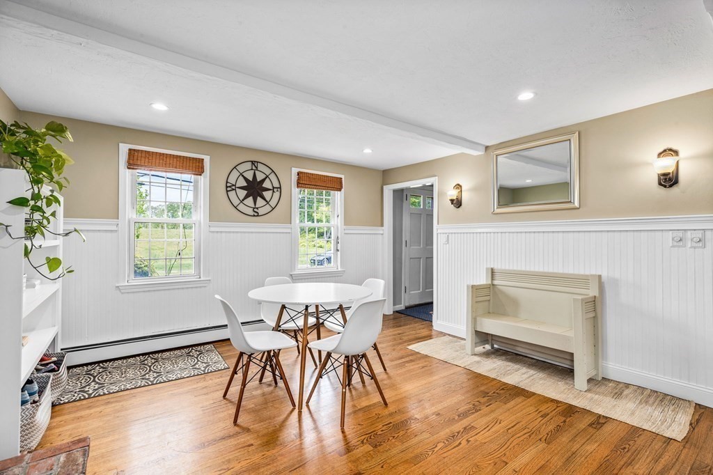 207 Tilden Road Scituate, MA 02066 - Photo 13 of 34 a view of a dining room with furniture window and wooden floor