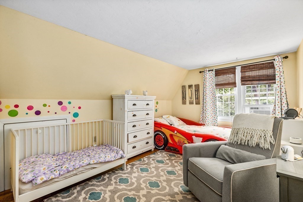 207 Tilden Road Scituate, MA 02066 - Photo 19 of 34 a bedroom with furniture and a bed