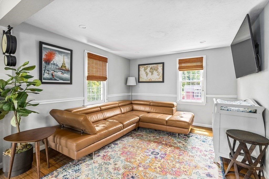 207 Tilden Road Scituate, MA 02066 - Photo 2 of 34 a living room with furniture and a flat screen tv