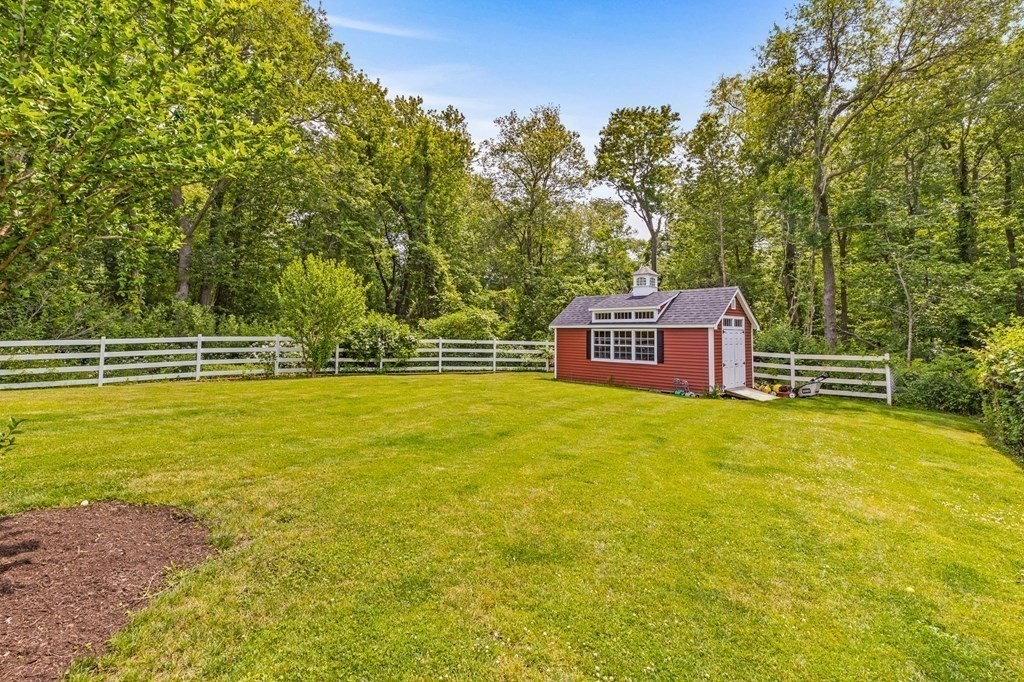 207 Tilden Road Scituate, MA 02066 - Photo 22 of 34 a view of a swimming pool with a yard and trees