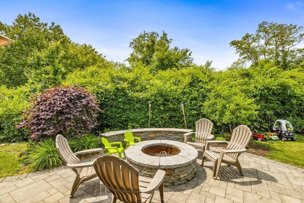 207 Tilden Road Scituate, MA 02066 - Photo 27 of 34 a table and chairs in a patio