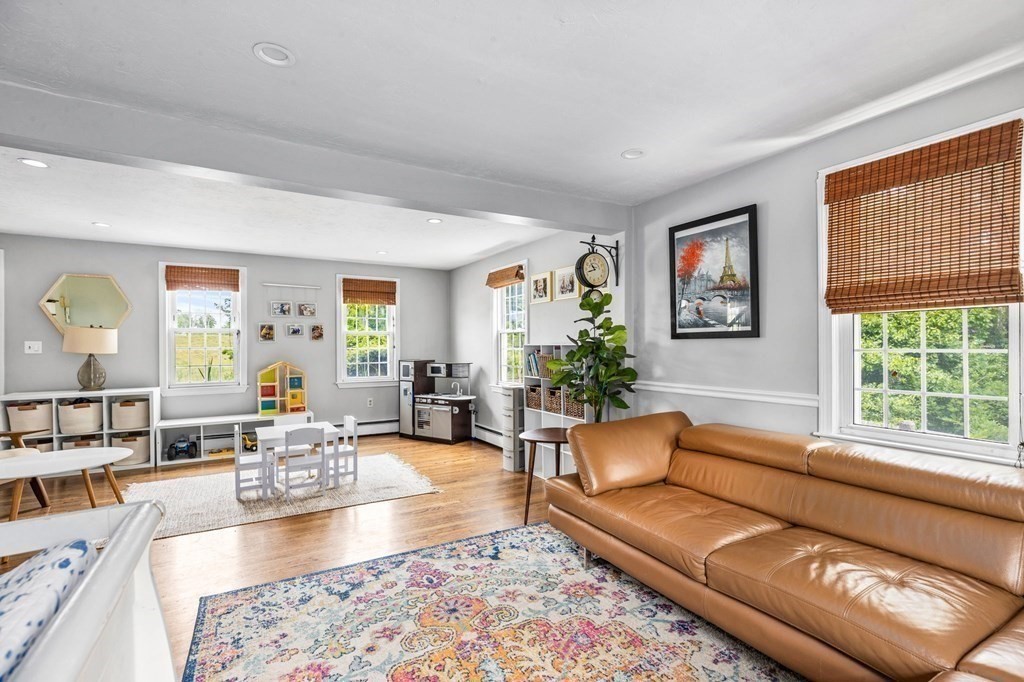 207 Tilden Road Scituate, MA 02066 - Photo 3 of 34 a living room with furniture and a large window