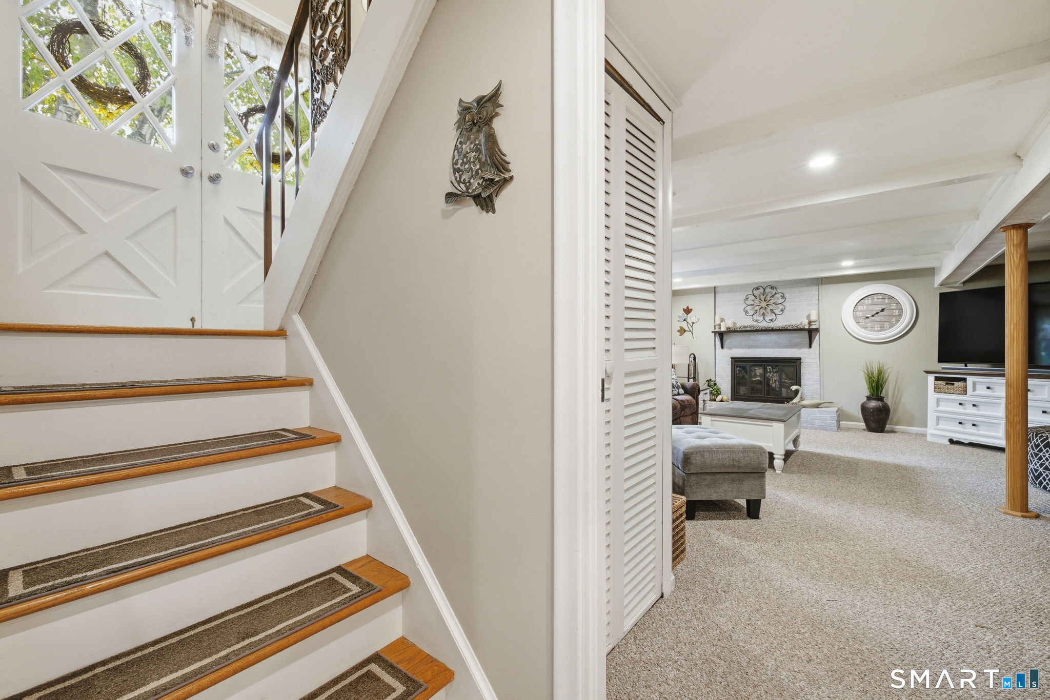 7 Stardust Drive Enfield, CT 06082 - Photo 18 of 38 a view of a livingroom with furniture and staircase