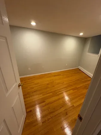 an empty room with wooden floor