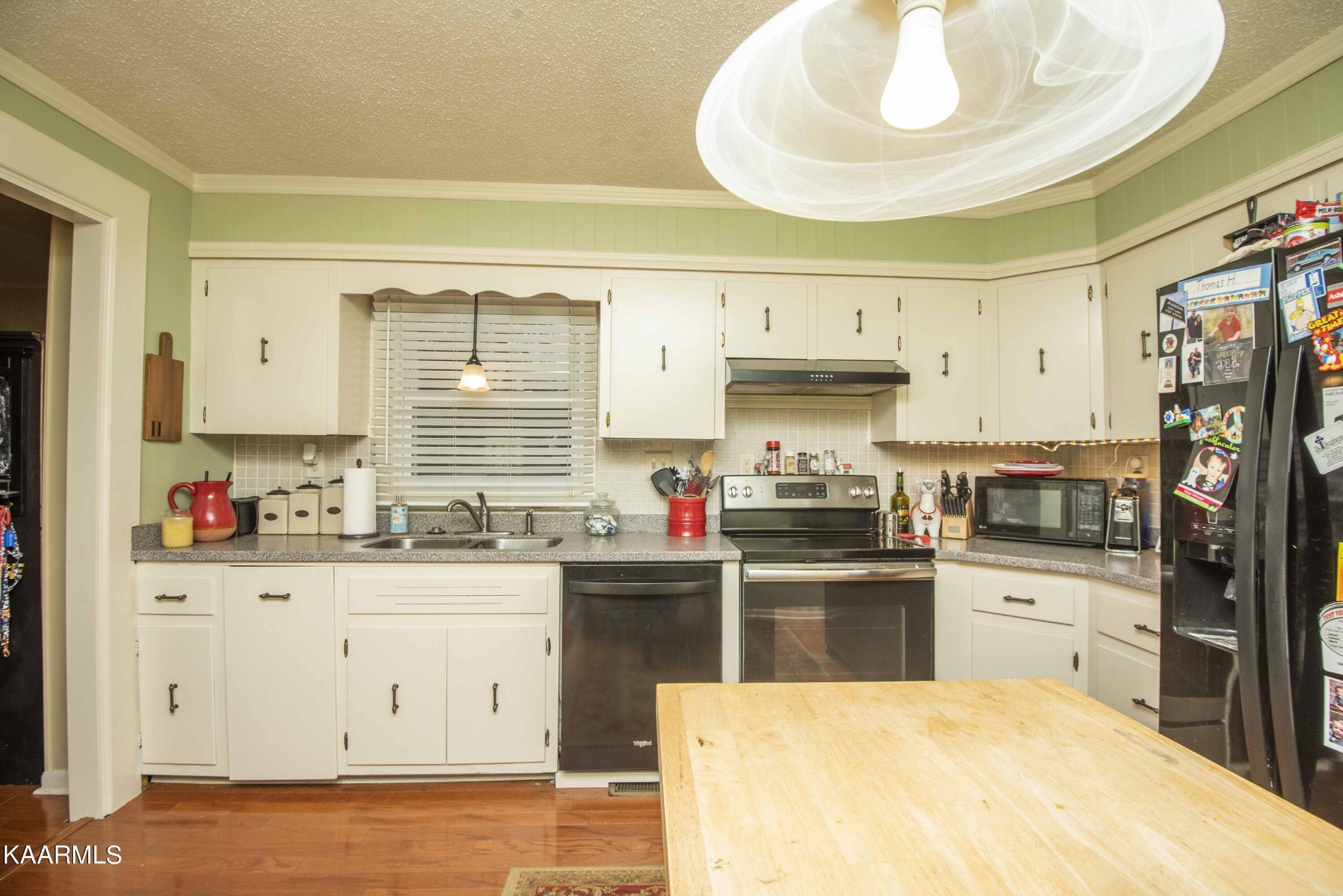 118 Tabor Road Oak Ridge, TN 37830 - Photo 31 of 44 a kitchen with stainless steel appliances a sink a stove a refrigerator cabinets and a window