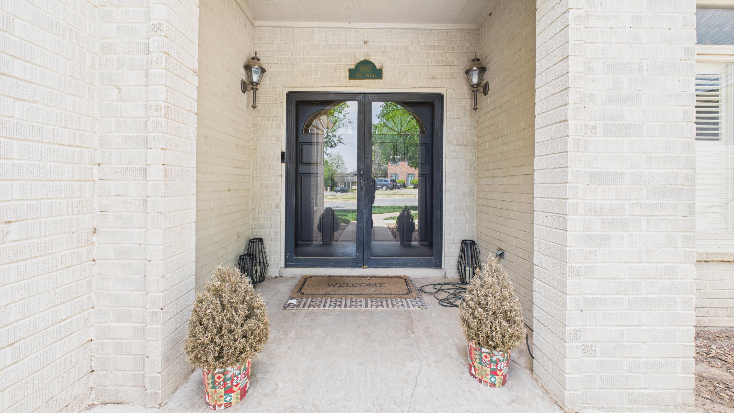 4615 94th Street Lubbock, TX 79424 - Photo 11 of 82 a view of a entryway door of the house