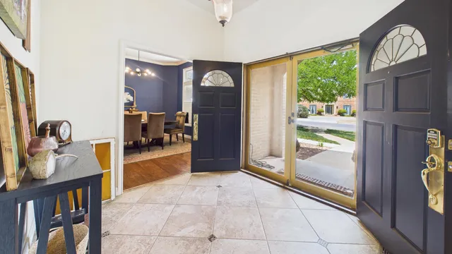 a kitchen with stainless steel appliances granite countertop a sink a stove and a refrigerator