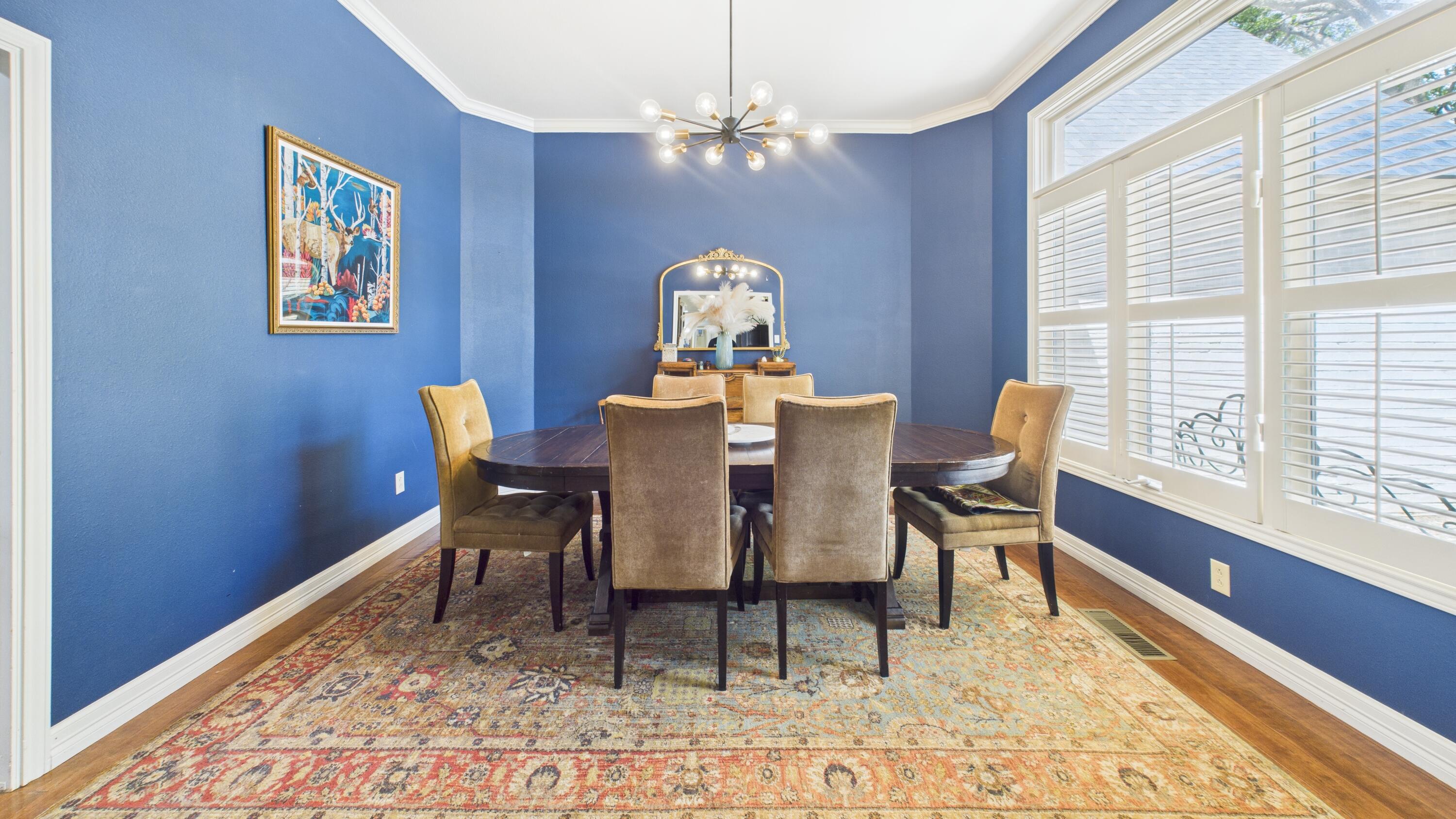 4615 94th Street Lubbock, TX 79424 - Photo 17 of 82 a view of a dining room with furniture window and wooden floor