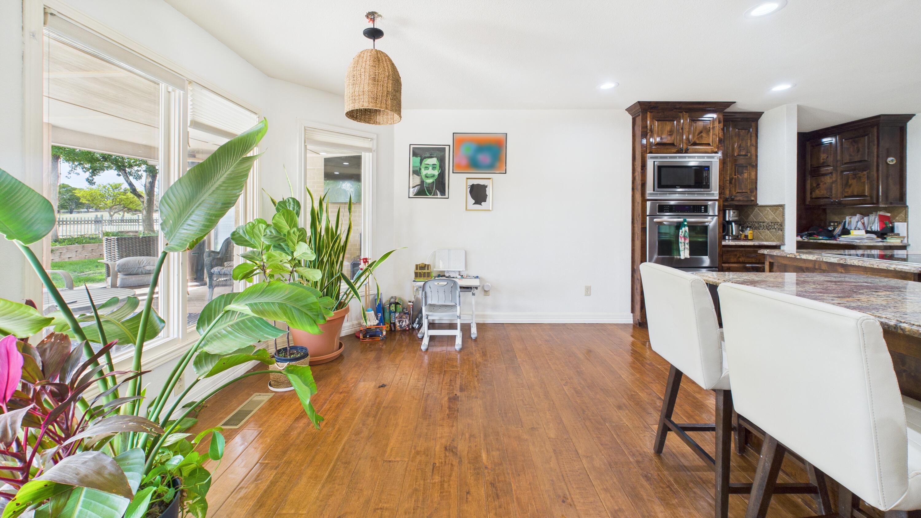 4615 94th Street Lubbock, TX 79424 - Photo 26 of 82 a living room with furniture and a potted plant