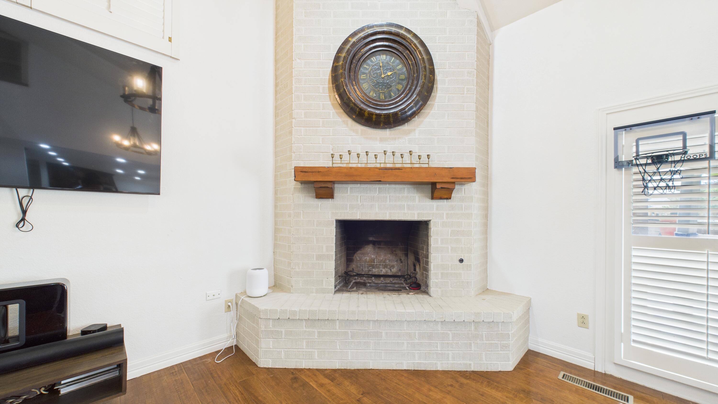 4615 94th Street Lubbock, TX 79424 - Photo 32 of 82 a living room with furniture and a fireplace