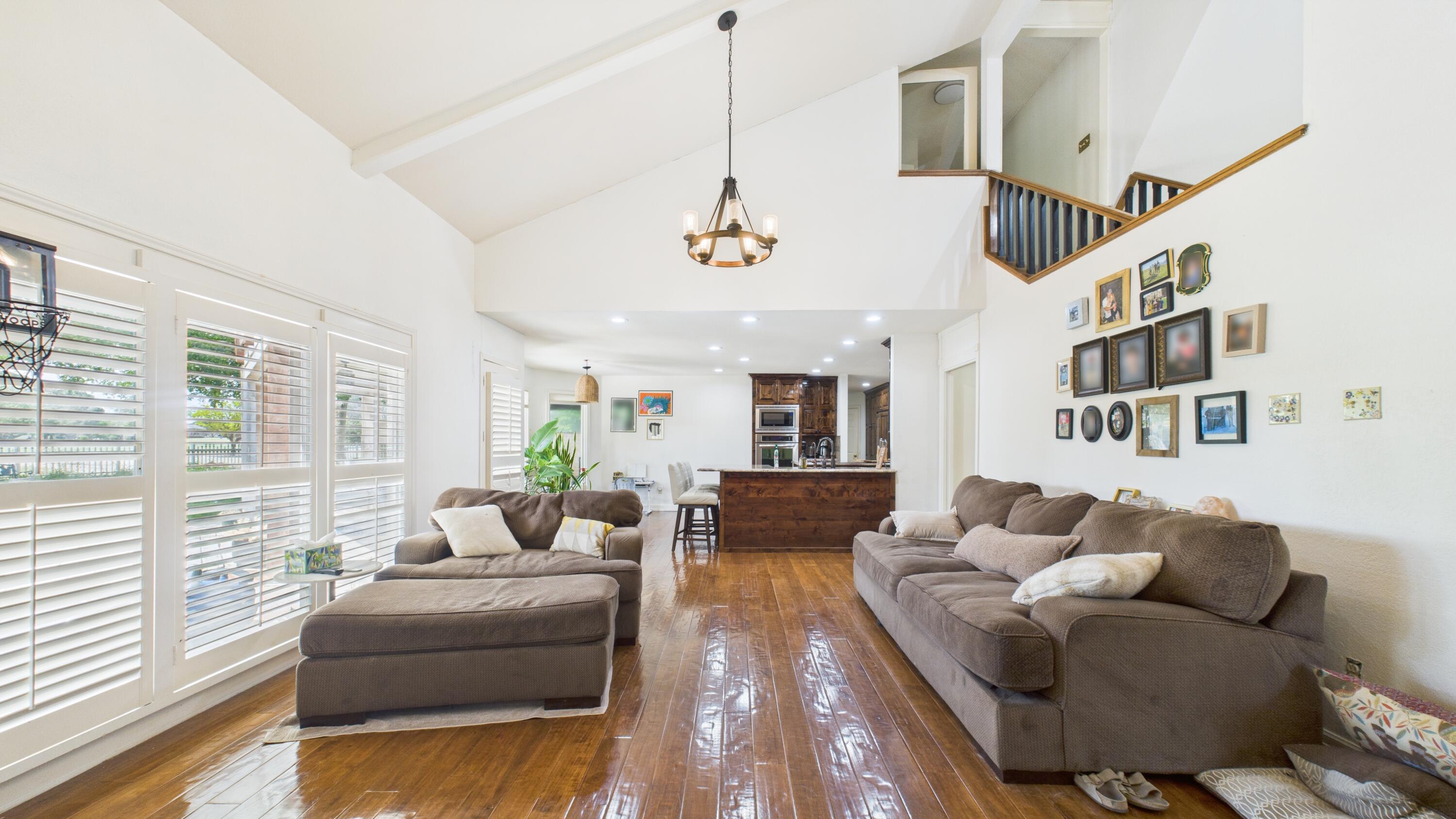 4615 94th Street Lubbock, TX 79424 - Photo 34 of 82 a living room with furniture ceiling fan and a window