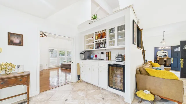a bath room with a granite countertop sink and a mirror