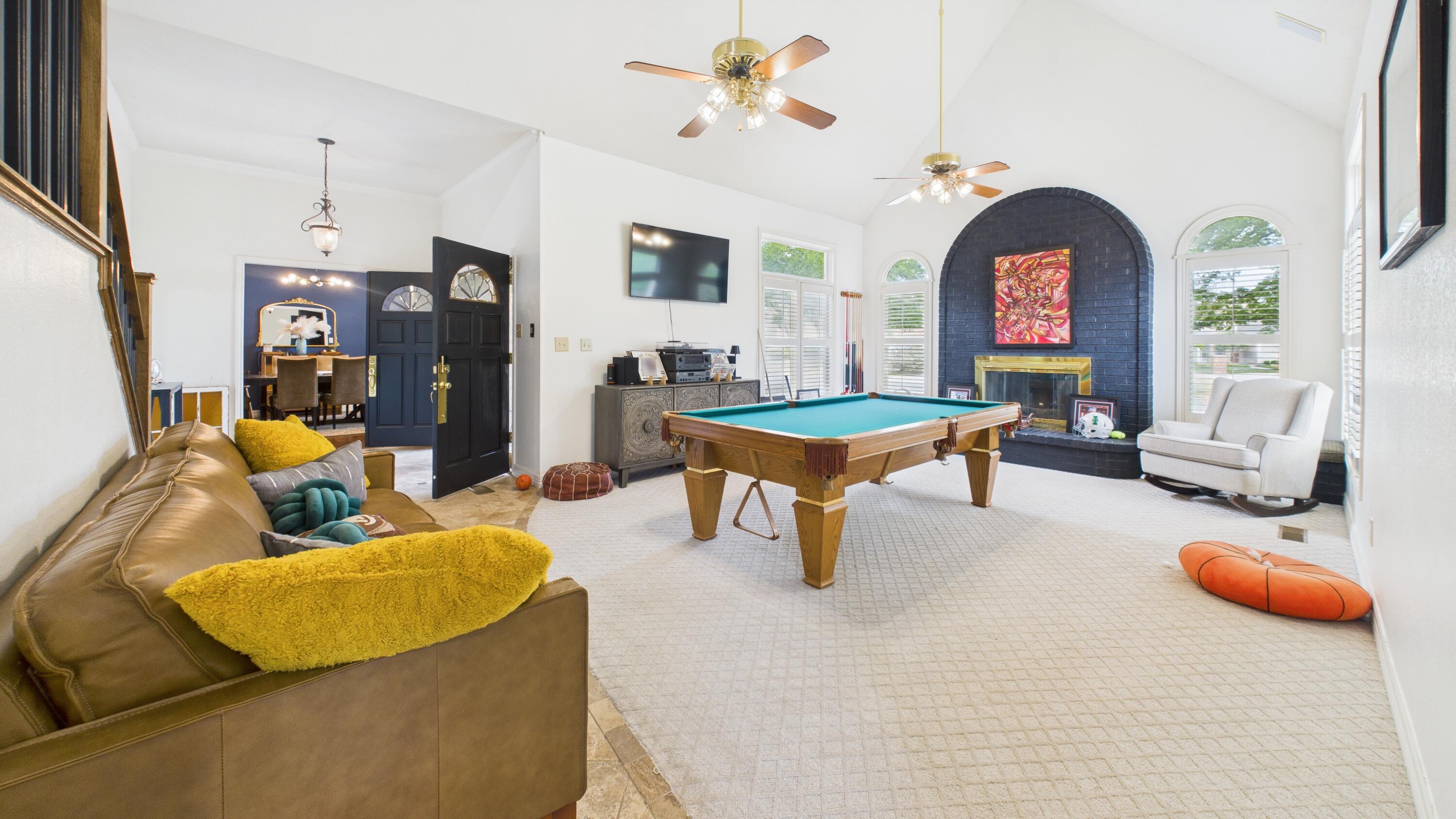 4615 94th Street Lubbock, TX 79424 - Photo 37 of 82 a living room with furniture and fireplace