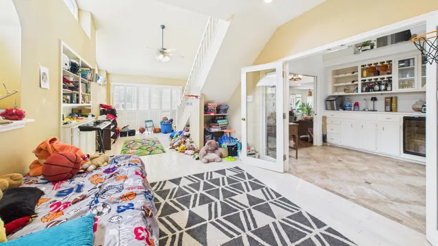 an aerial view of house with backyard space and garden