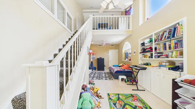 an aerial view of a house with swimming pool and outdoor seating