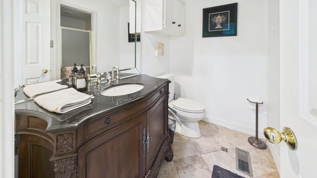 an aerial view of house with backyard