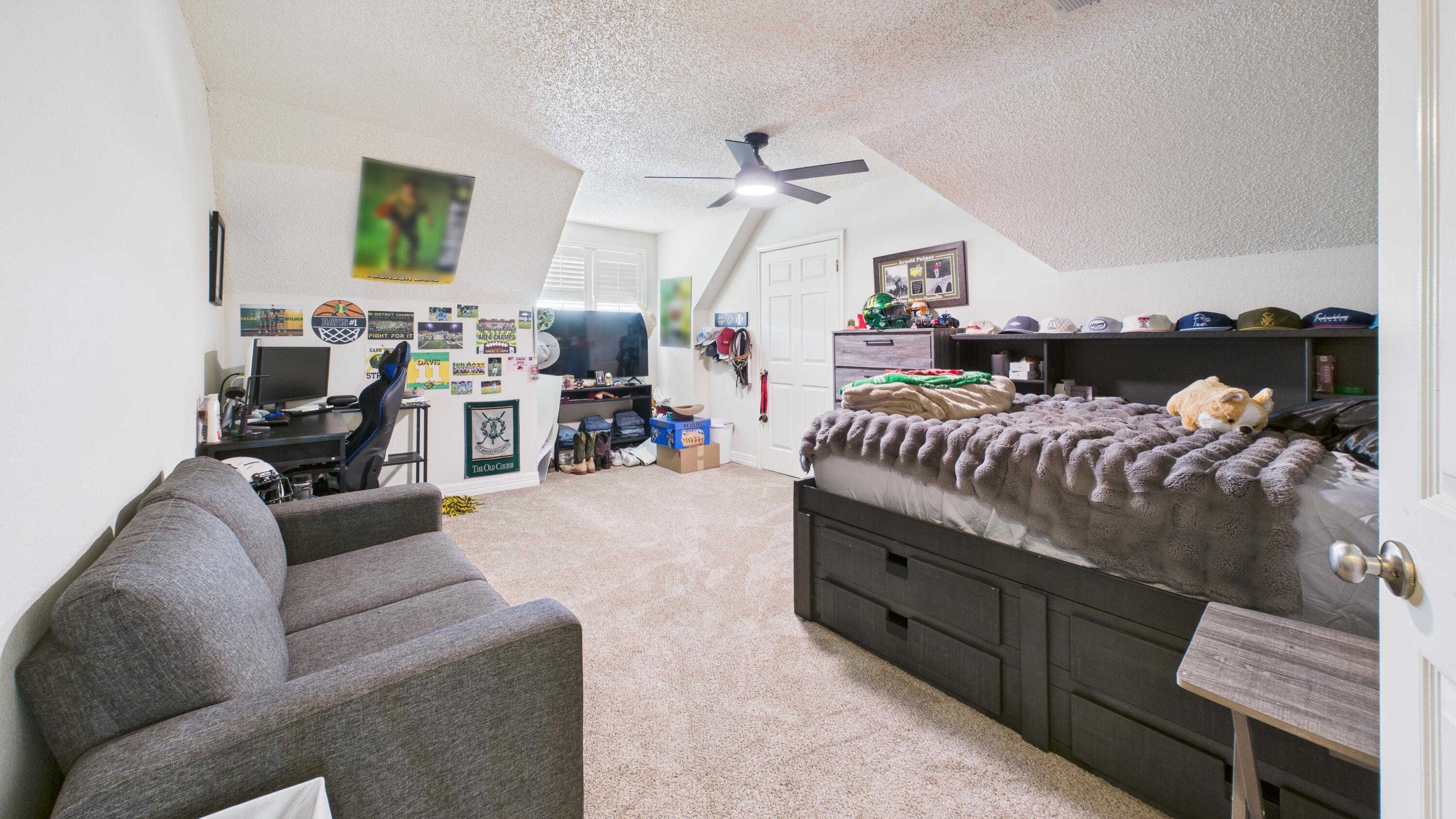 4615 94th Street Lubbock, TX 79424 - Photo 66 of 82 a living room with furniture and a wooden floor