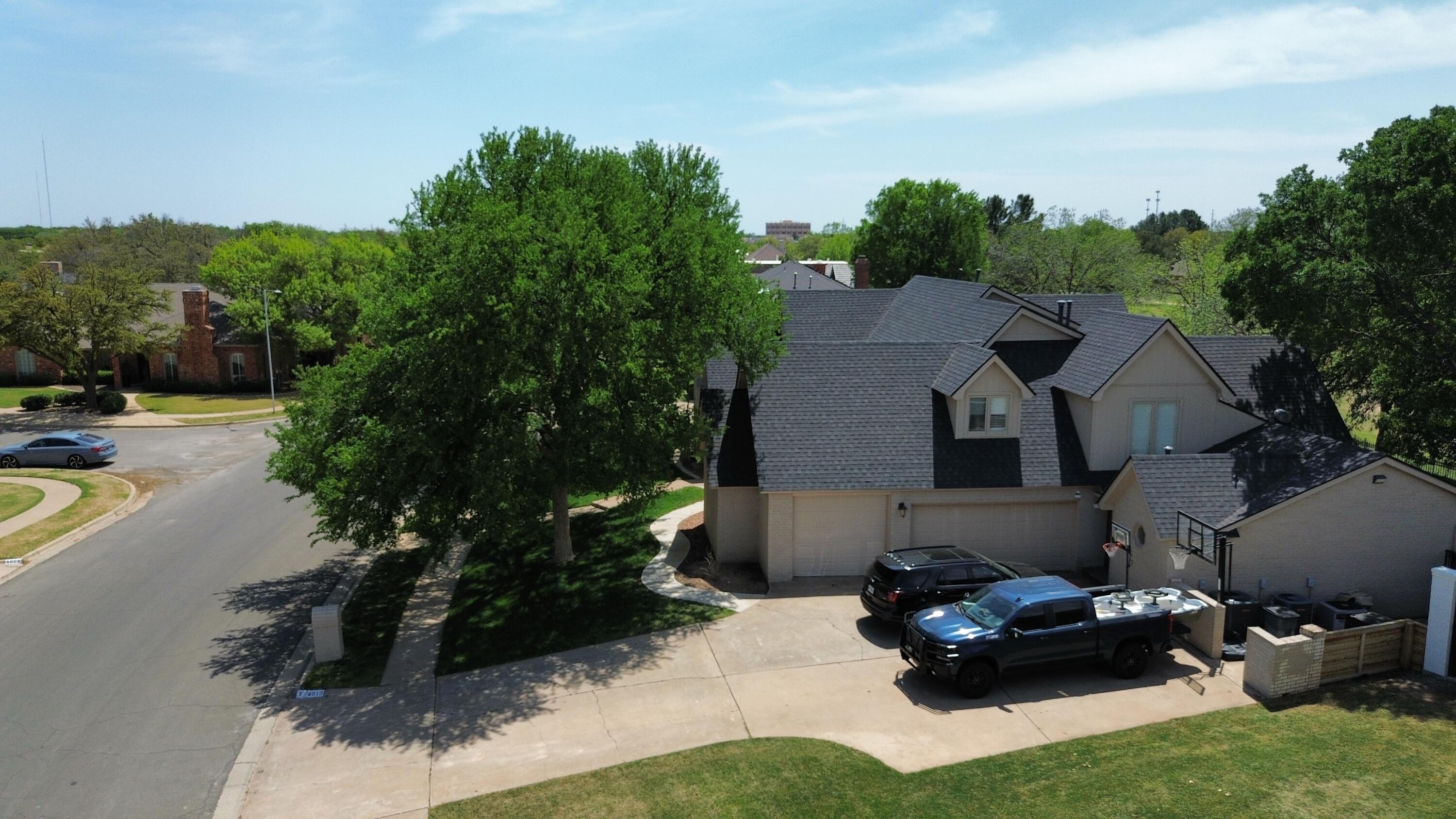 4615 94th Street Lubbock, TX 79424 - Photo 79 of 82 a couple of cars parked in front of a house