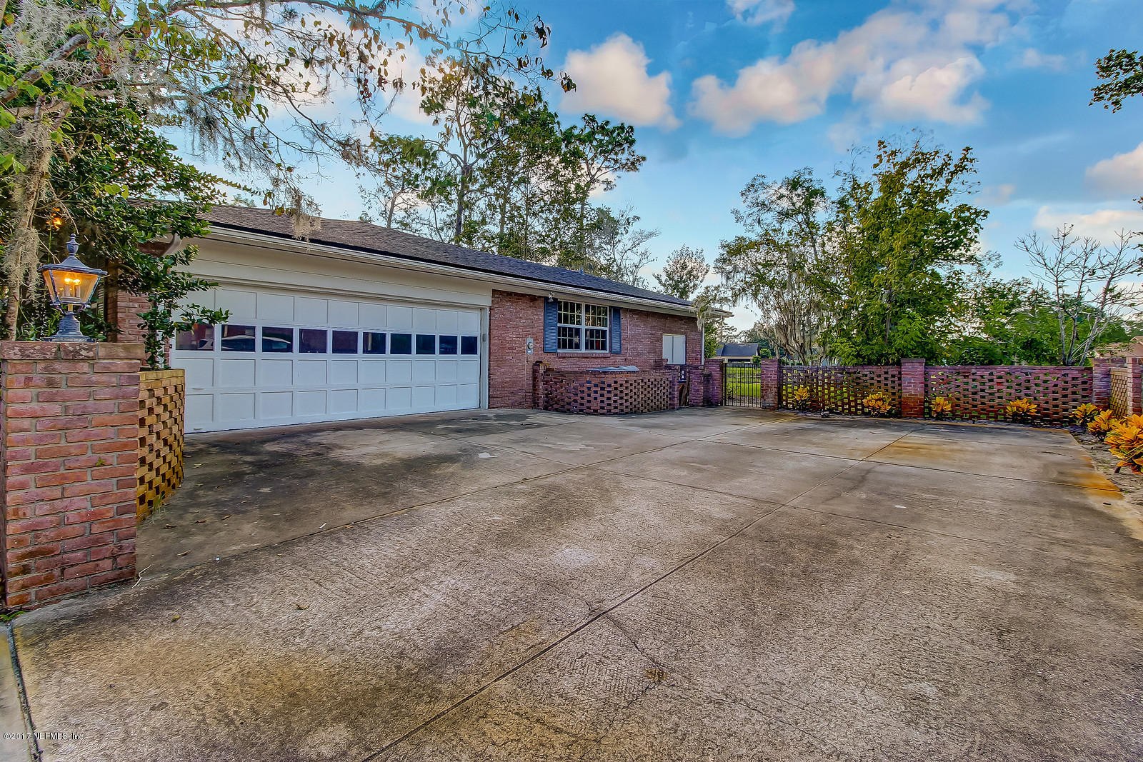8112 Pine Lake Road Jacksonville, FL 32256 - Photo 42 of 65 side entry garage with courtyard