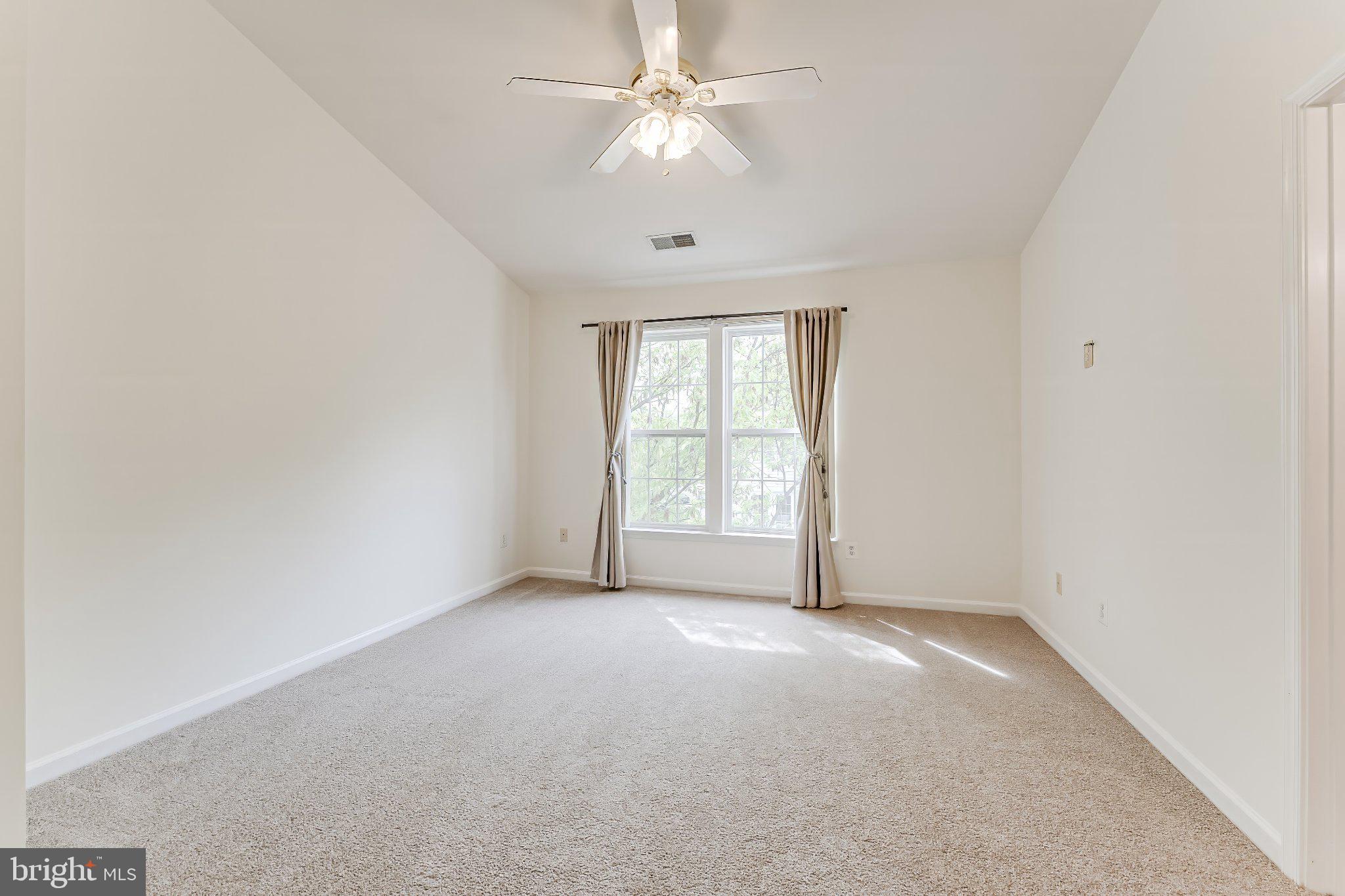 6414 Lureta Ann Lane Springfield, VA 22150 - Photo 16 of 44 an empty room with a window and a fan