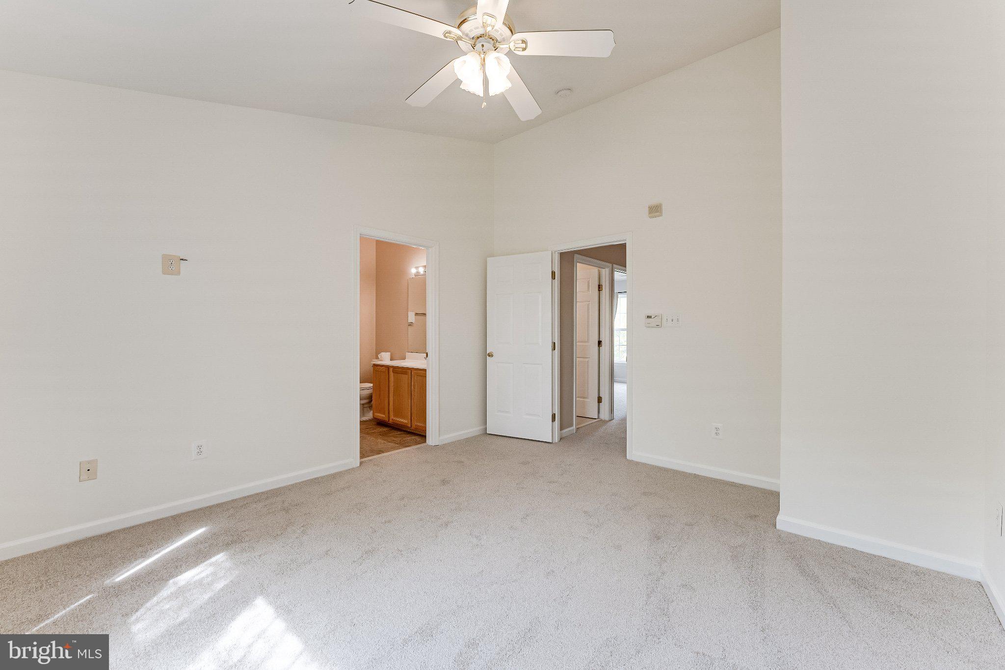 6414 Lureta Ann Lane Springfield, VA 22150 - Photo 18 of 44 an empty room with closet and a ceiling fan
