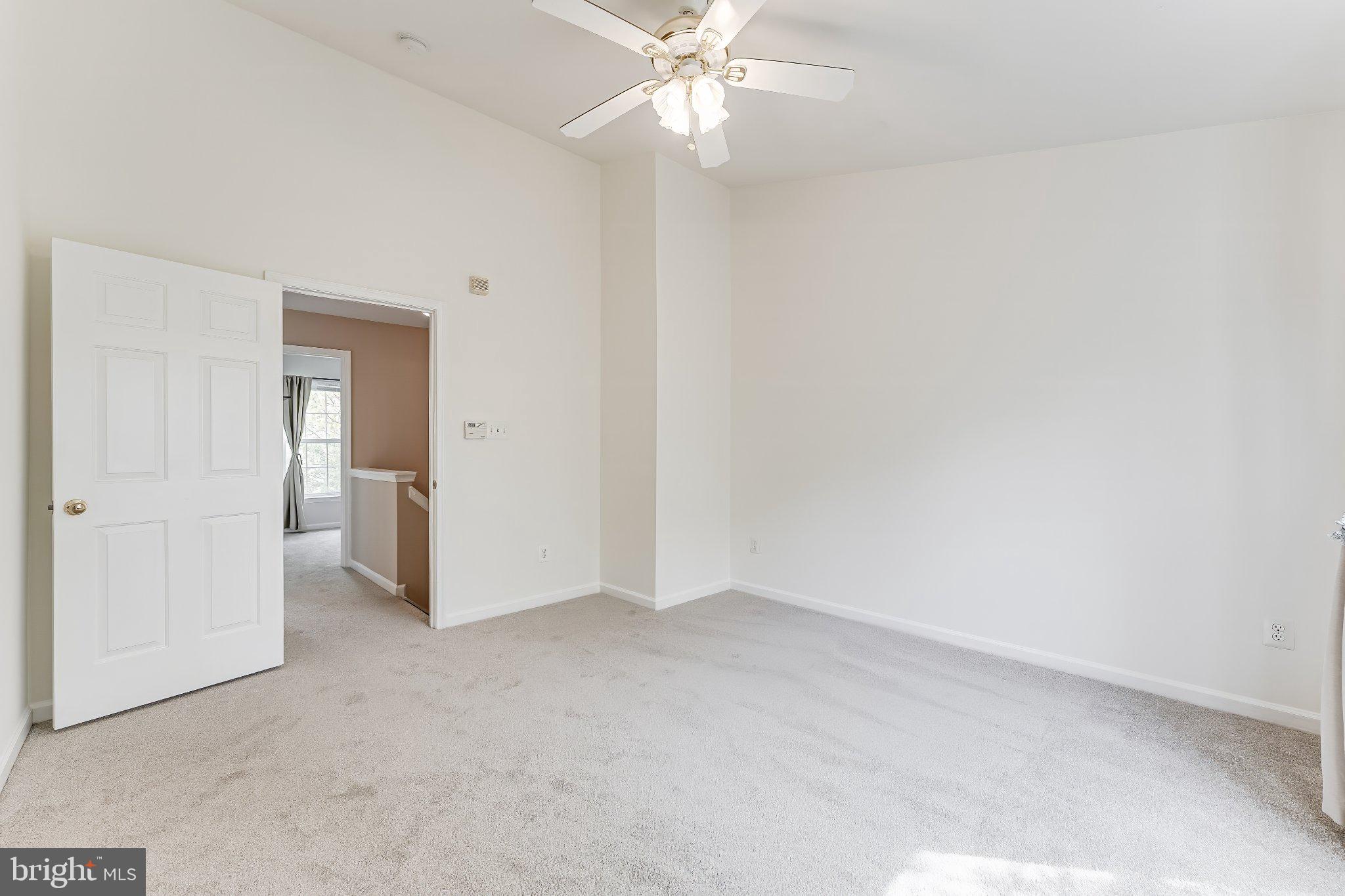 6414 Lureta Ann Lane Springfield, VA 22150 - Photo 19 of 44 an empty room with fan and entrance