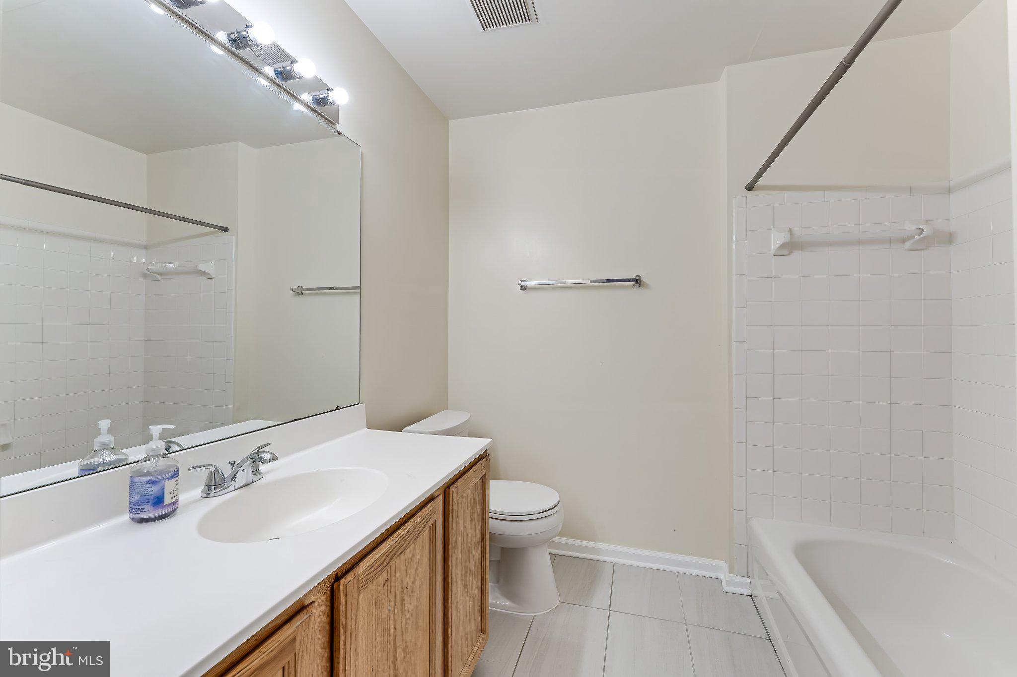 6414 Lureta Ann Lane Springfield, VA 22150 - Photo 27 of 44 a bathroom with a sink toilet and shower