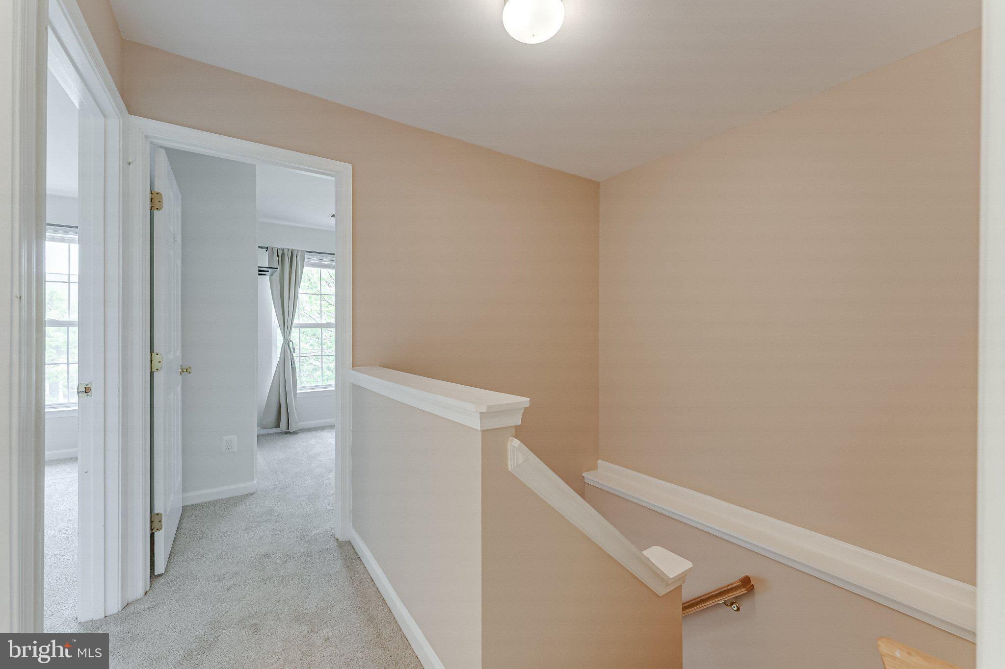 6414 Lureta Ann Lane Springfield, VA 22150 - Photo 32 of 44 a view of a hallway with wooden floor
