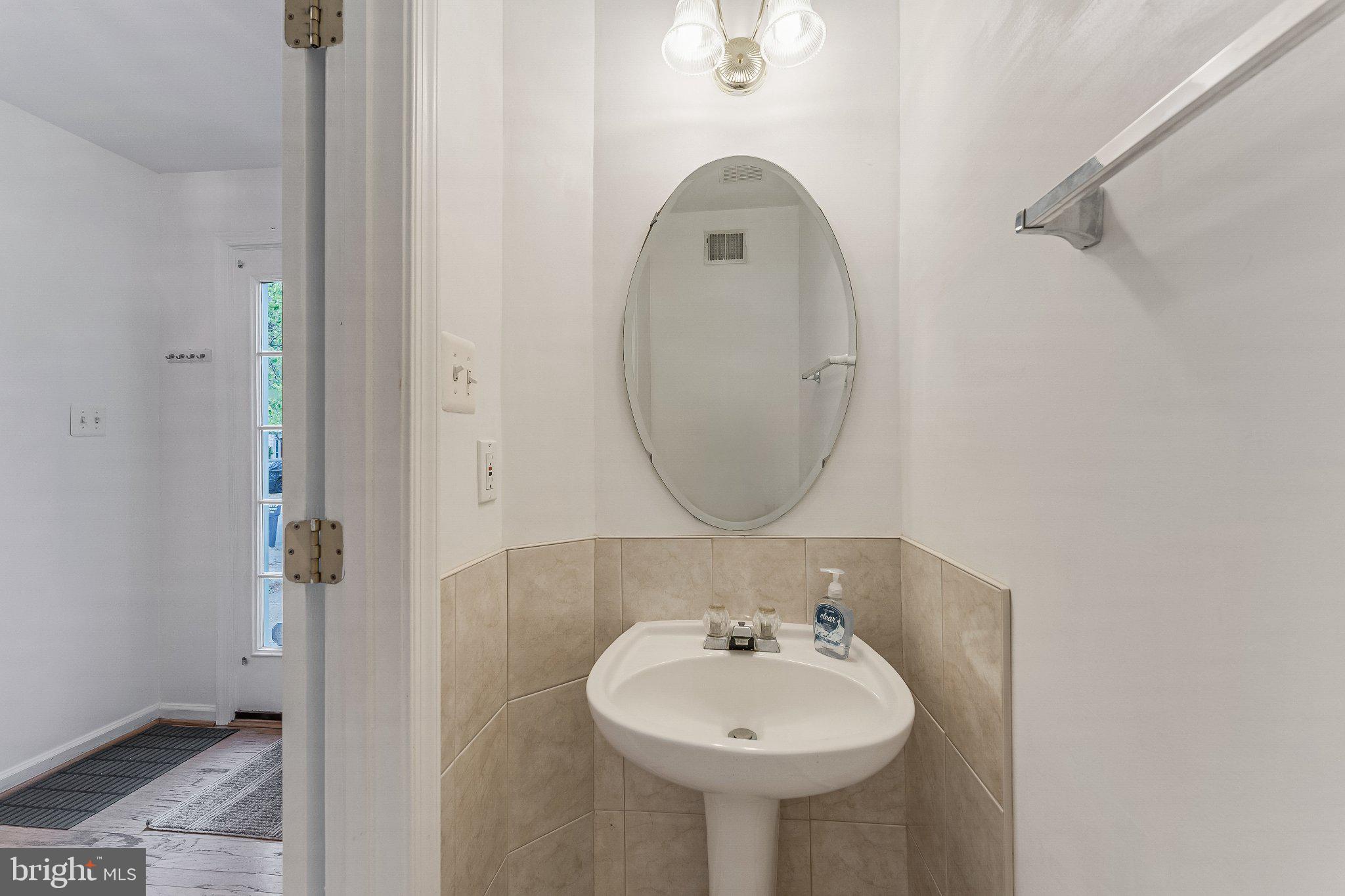 6414 Lureta Ann Lane Springfield, VA 22150 - Photo 34 of 44 a bathroom with a sink and a mirror