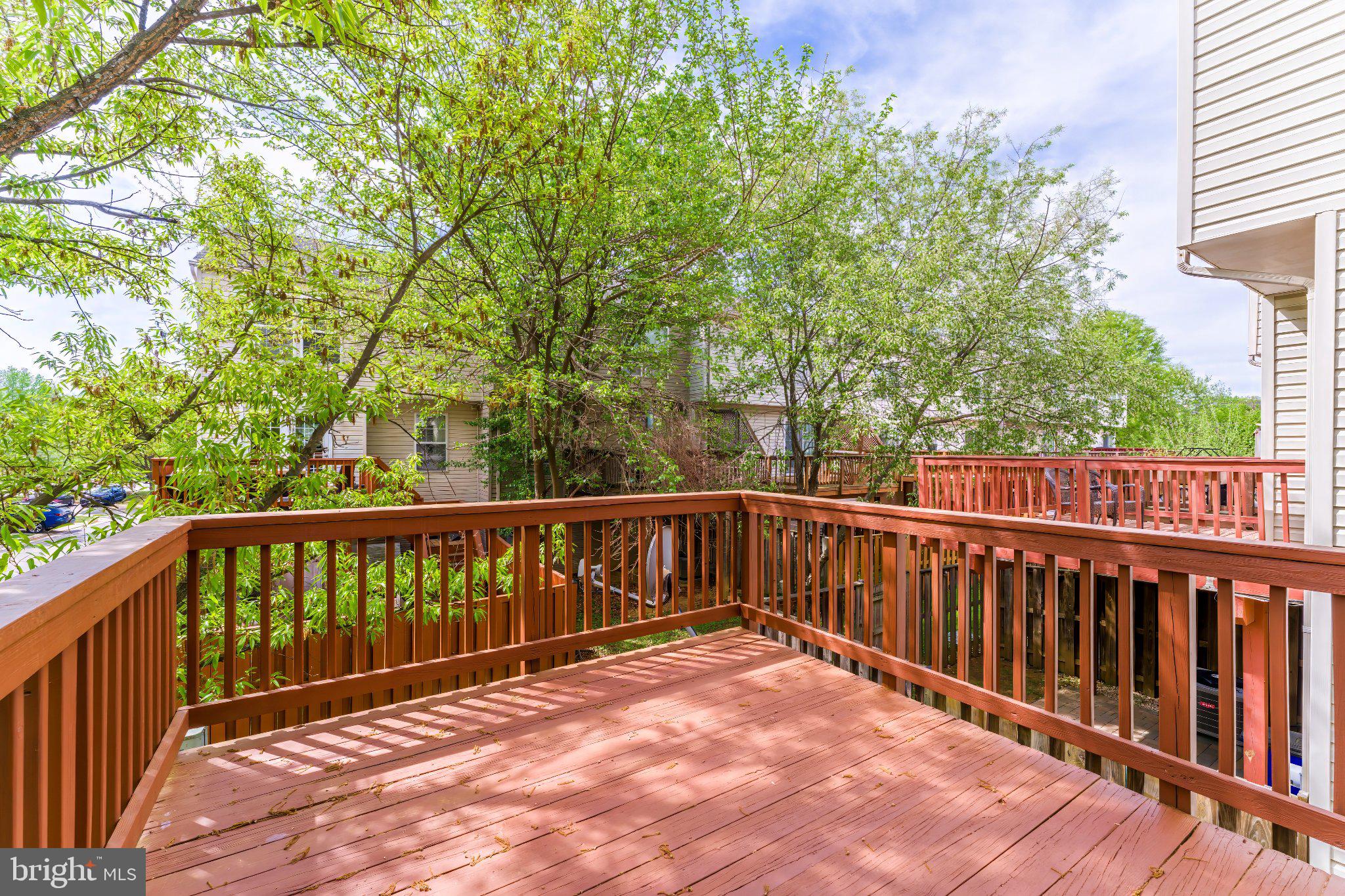 6414 Lureta Ann Lane Springfield, VA 22150 - Photo 38 of 44 a balcony with wooden floor and fence